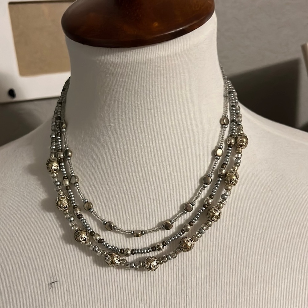 Gold and silver necklace.